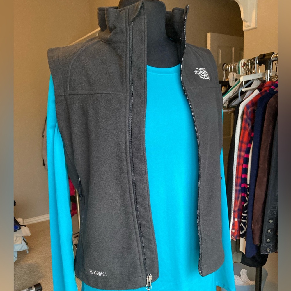 The North Face black Windwall vest with zip pockets, size small